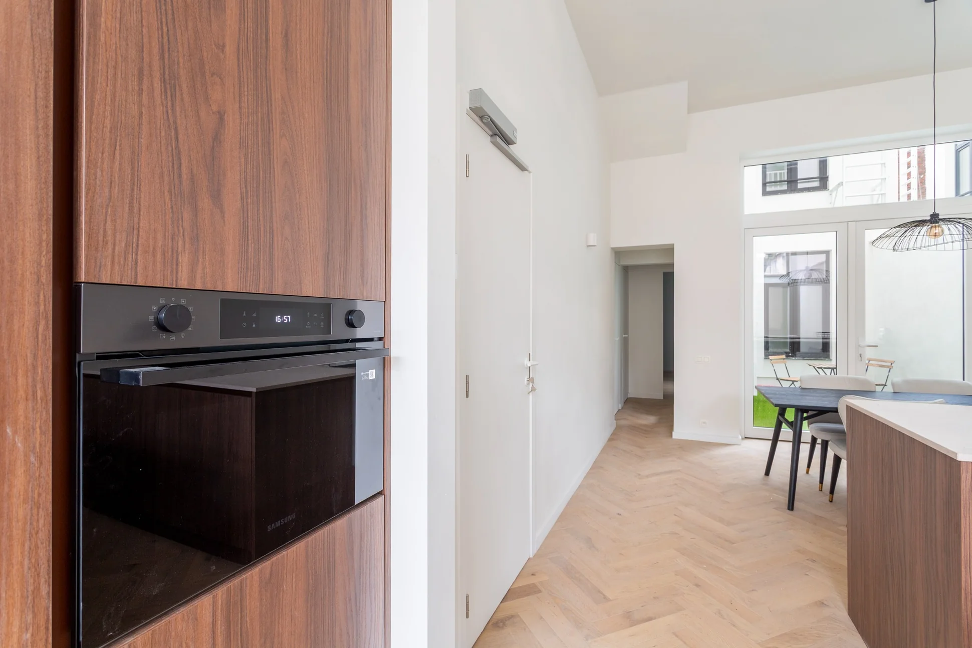Selected interior at The Kronenburg, featuring timber cabinetry and natural light