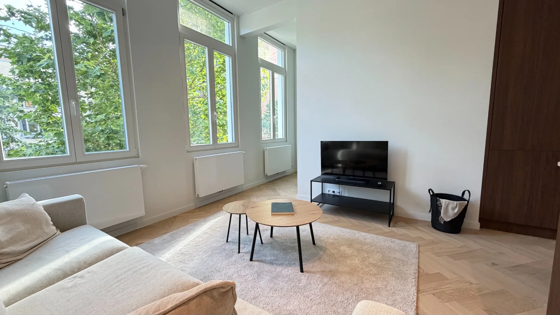 Warm bright living room with large windows